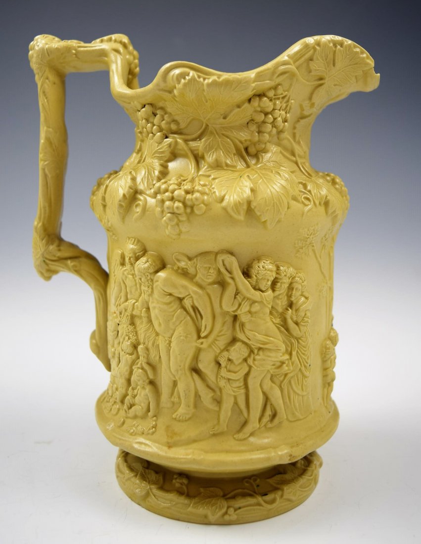 Charles Meigh Stoneware: Circa 1840's English Charles Meigh white stoneware pitcher decorated with a scene of Bacchus, grapes and wine Measures: 8 x 6 1/2 inches