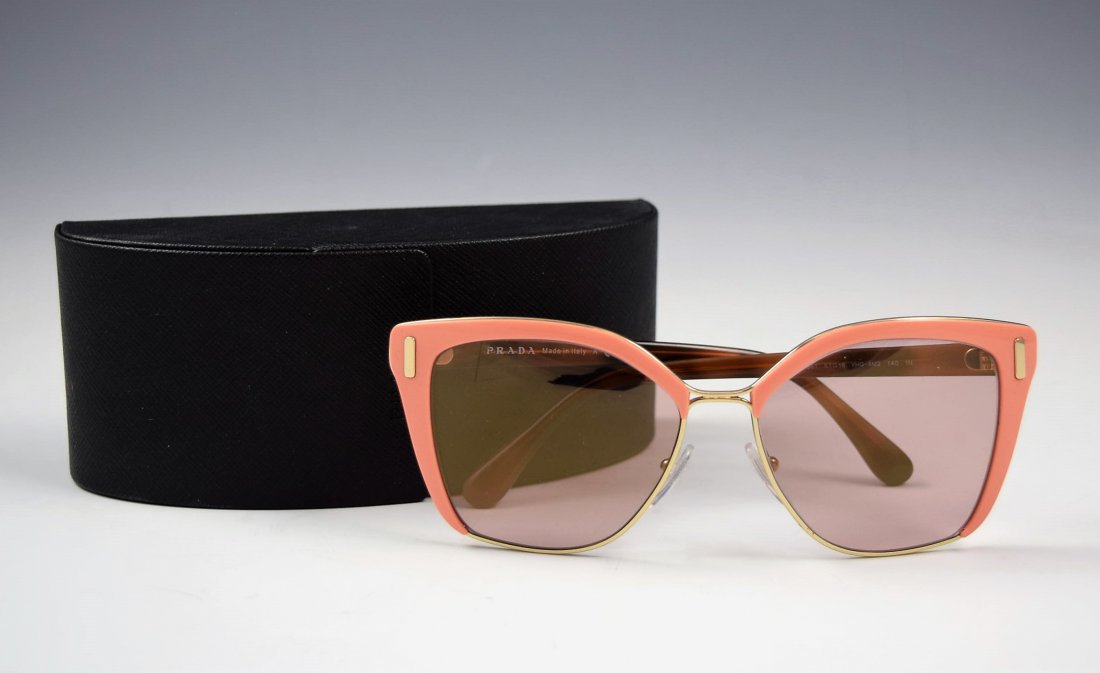 Prada Sunglasses: Prada issued womans pink and rose gold sunglasses Original case included