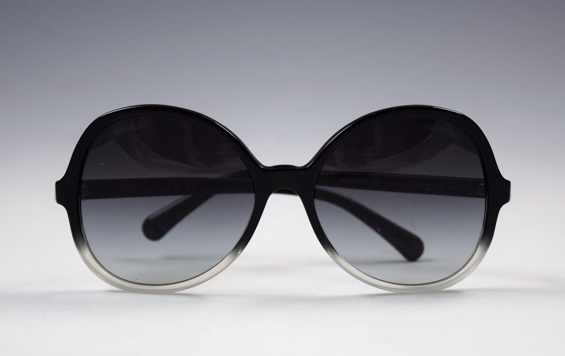 Chanel Sunglasses: Chanel issued womens black sunglasses with silver accents