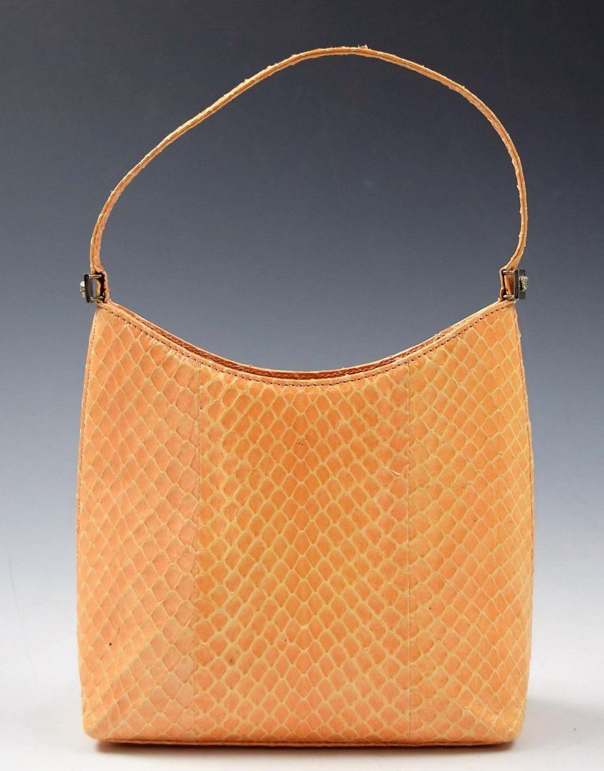 Versace Handbag: Gianni Versace light peach glossy fish-scale exterior handbag with silver hardware Measures: 8.25 x 5.5 x 2 inches
