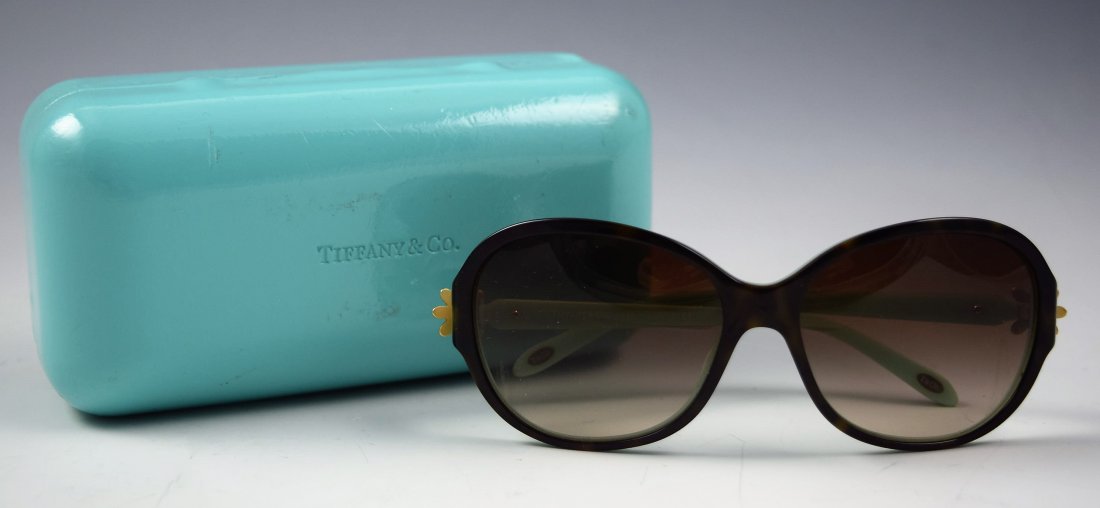 Tiffany & Co Sunglasses: Tiffany & Co women's sunglasses featuring gold toned flower accents Original case included