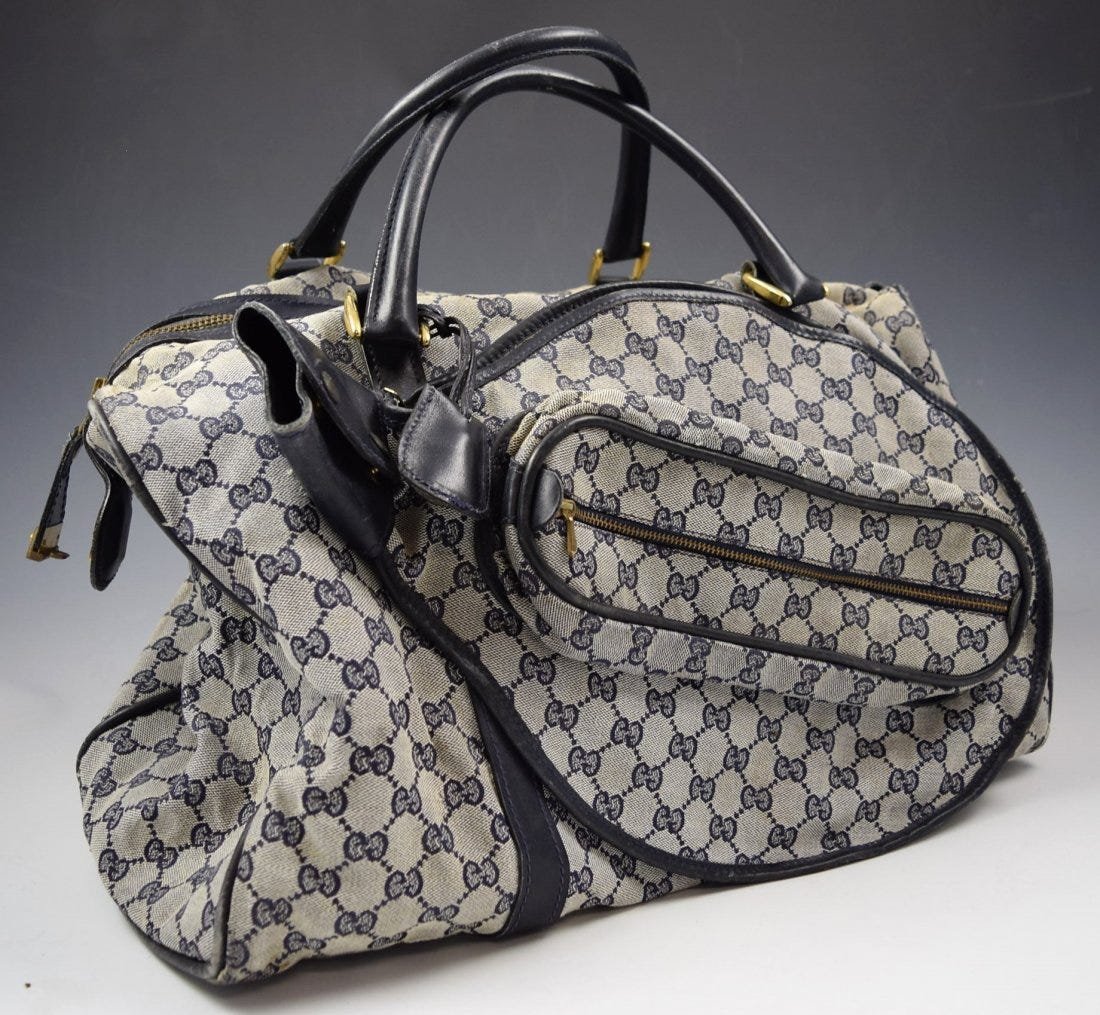 Vintage Gucci Tennis Bag: Vintage Gucci canvas tennis bag with leather trim Measures: 17 x 15 x 8 inches