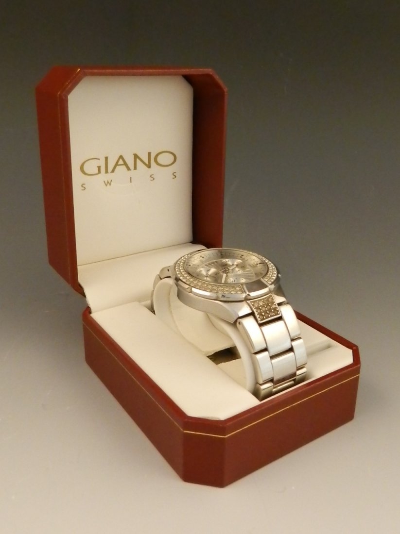 Men's Guess Chronograph Watch: Stainless steel band, silver chronograph dial, with a jeweled bezel Box inlcuded