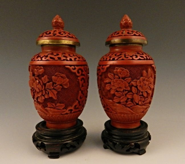 Chinese Cinnabar Blue Enamel Ginger Jars: 4 1/2 inches in total height each, 20th century Hand carved blue enamel in a floral design The vases are from a private collection and were purchased in China by the owner over 30 years ago.