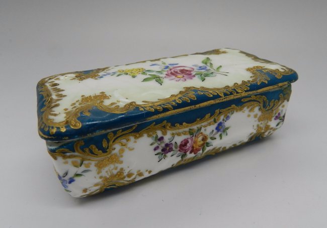 A French Sevres Enamel Cobalt Stamp Box: Circa 1840 Sevres French enamel and cobalt stamp box with a floral design Measures: 3 1/2 inches