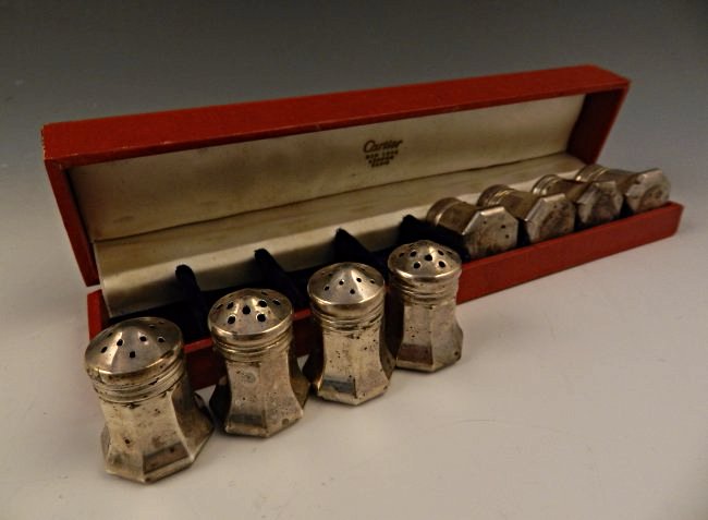 Cartier Sterling Silver Set: A full set salt cellars with original box Measures: 1 1/2 inches tall Stamped on bottom Cartier