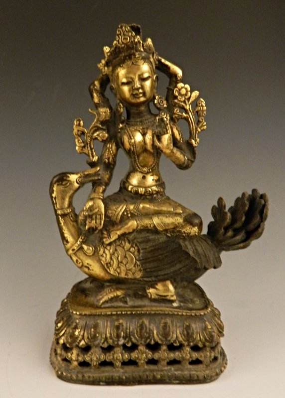 Chinese Bronze Seated Buddha: Chinese gilt bronze buddha sitting on a lotus base, wearing a crown & sitting on a bird With a leaf marking to the underside Measures: 9 1/2 inches in height 18th-19th century, Qing Dynasty