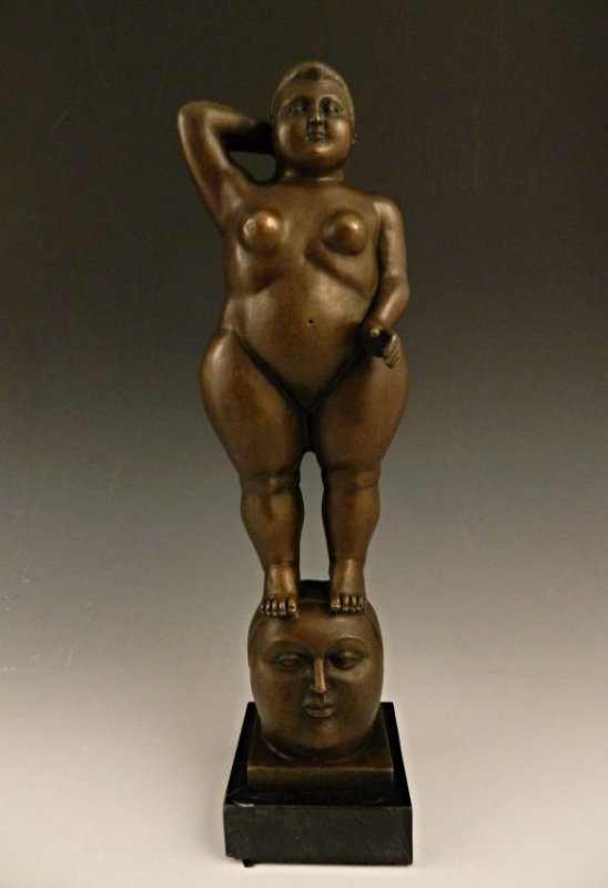 After Fernando Botero: A bronze sculpture of a standing nude, 20th c. Measures: 14 1/2 inches in height Signed on bottom