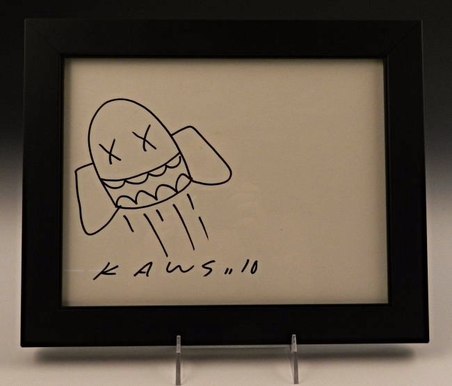 Kaws: (American, b. 1974) A marker on paper sketch, 20th c. Measures: 8 1/2 x 11 inches (paper size), framed: 13 x 10 inches Signed bottom left