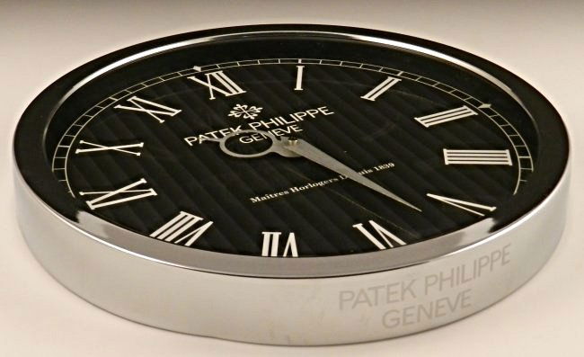 Patek Philippe Showroom Dealer Clock: Patek Philippe Black dealer advertising and promotional wall clock Labeling to backside Measures: 13 inches