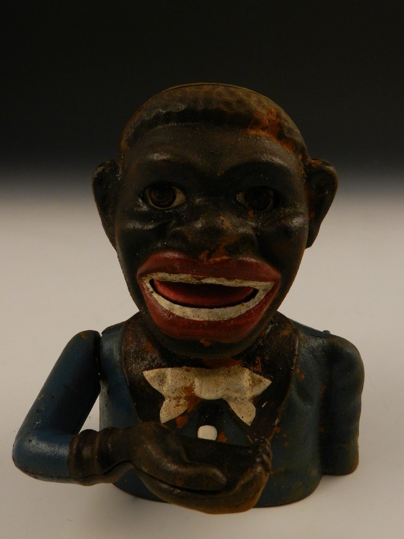 Black Americana Cast Iron Bank: Black Americana Jolly Negro cast iron bank J.E. Stevens Measures: 6 inches in height