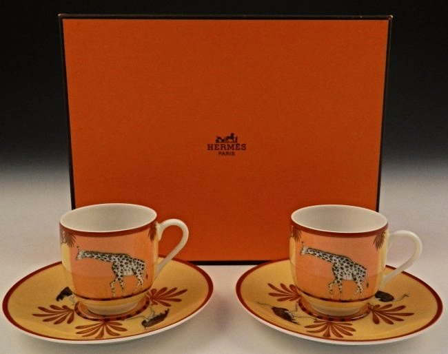 Hermes Porcelain Cup Set: "Africa" Porcelain Cup & Saucer set of 2 Cups measure: 2-3/8 x 2-3/8 inches Comes with original Hermes box