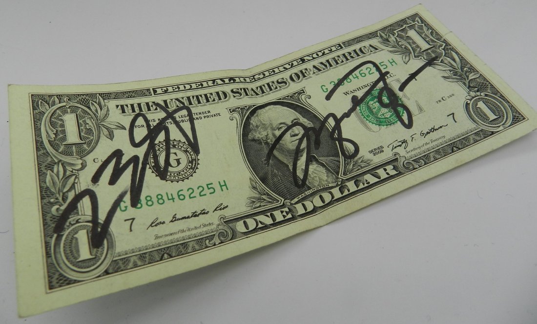 LeBron James & Michael Jordan Signed: Dollar bill signed by - LeBron James and Michael Jordan
