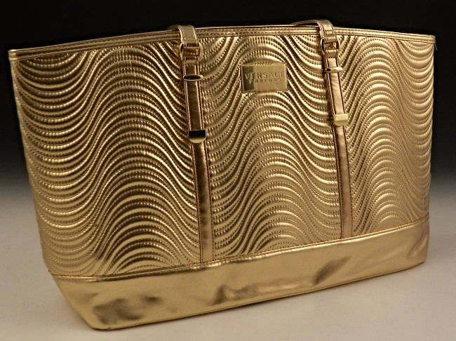 Versace Travel Tote Bag: A Versace issued travel tote bag Measures: 23 inches in length, bag size: 21 x 11 inches