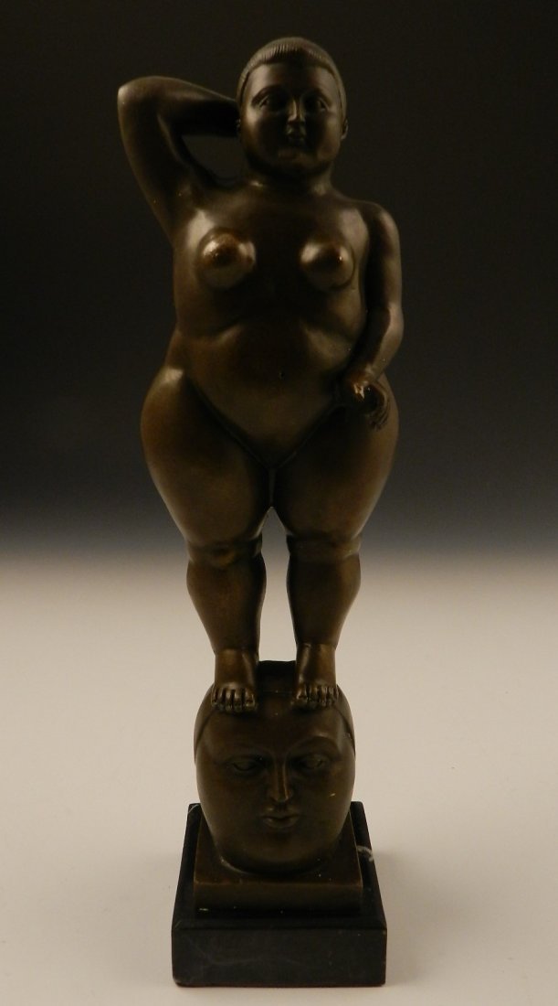 After Fernando Botero: A bronze sculpture of a standing nude, 20th c. Measures: 14 1/2 inches in height Signed on bottom