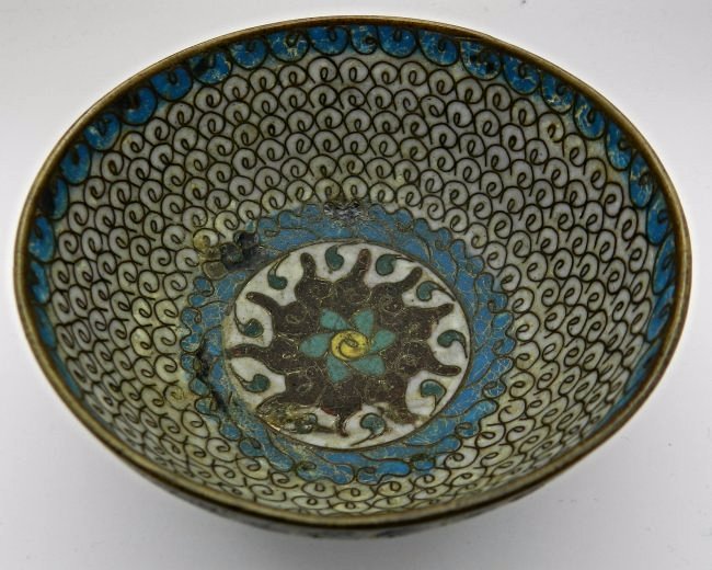 Chinese Ming Dynasty Cloisonne Bowl: A superb antique Chinese Ming Period (1368–1644) cloisonné on bronze small footed bowl, on turquoise ground, dating to c.1600 - 1700. The exterior is decorated with classic lotus flowers and scroll
