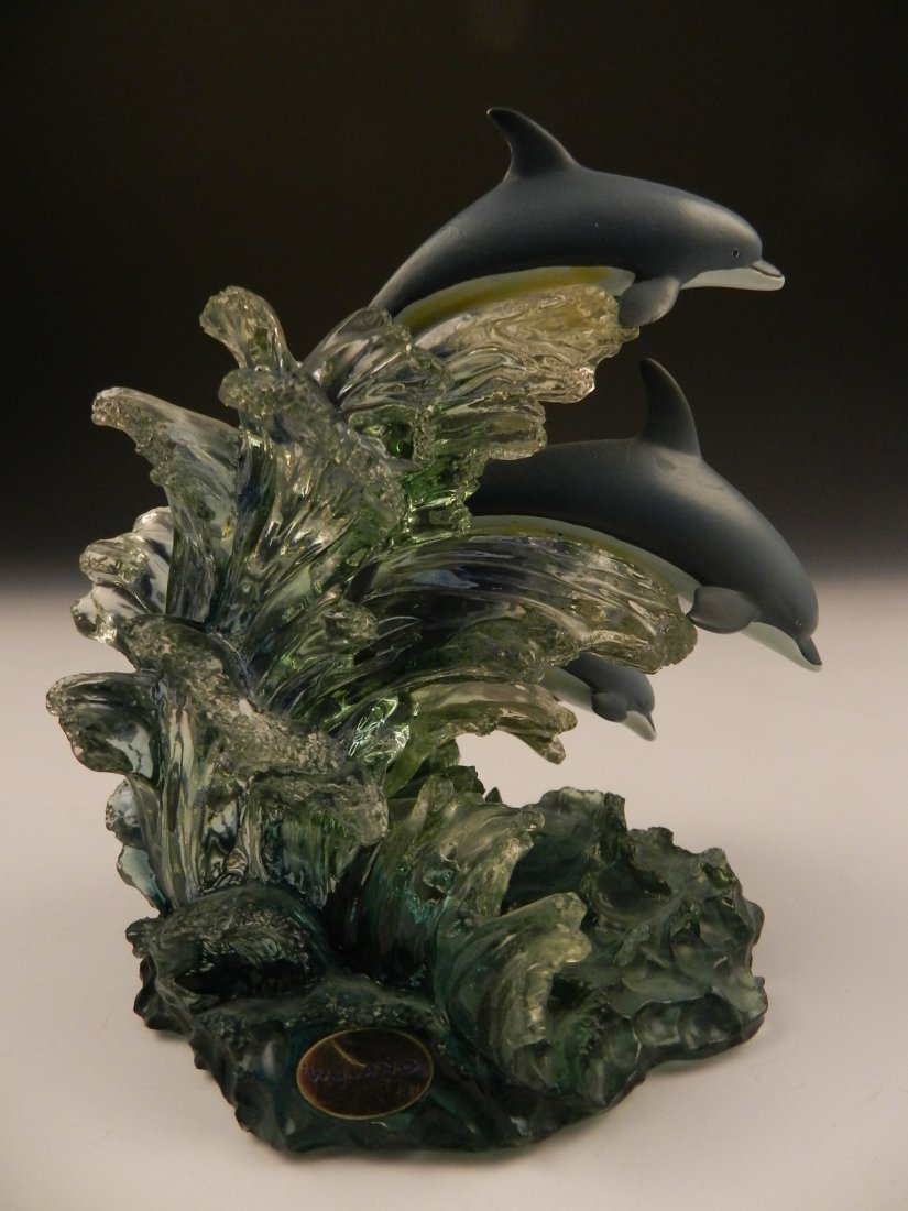 Robert Wyland Marine Sculpture: Dolphin Trio Measures: 5 1/2 x 5 inches Signed, stamped and numbered on bottom