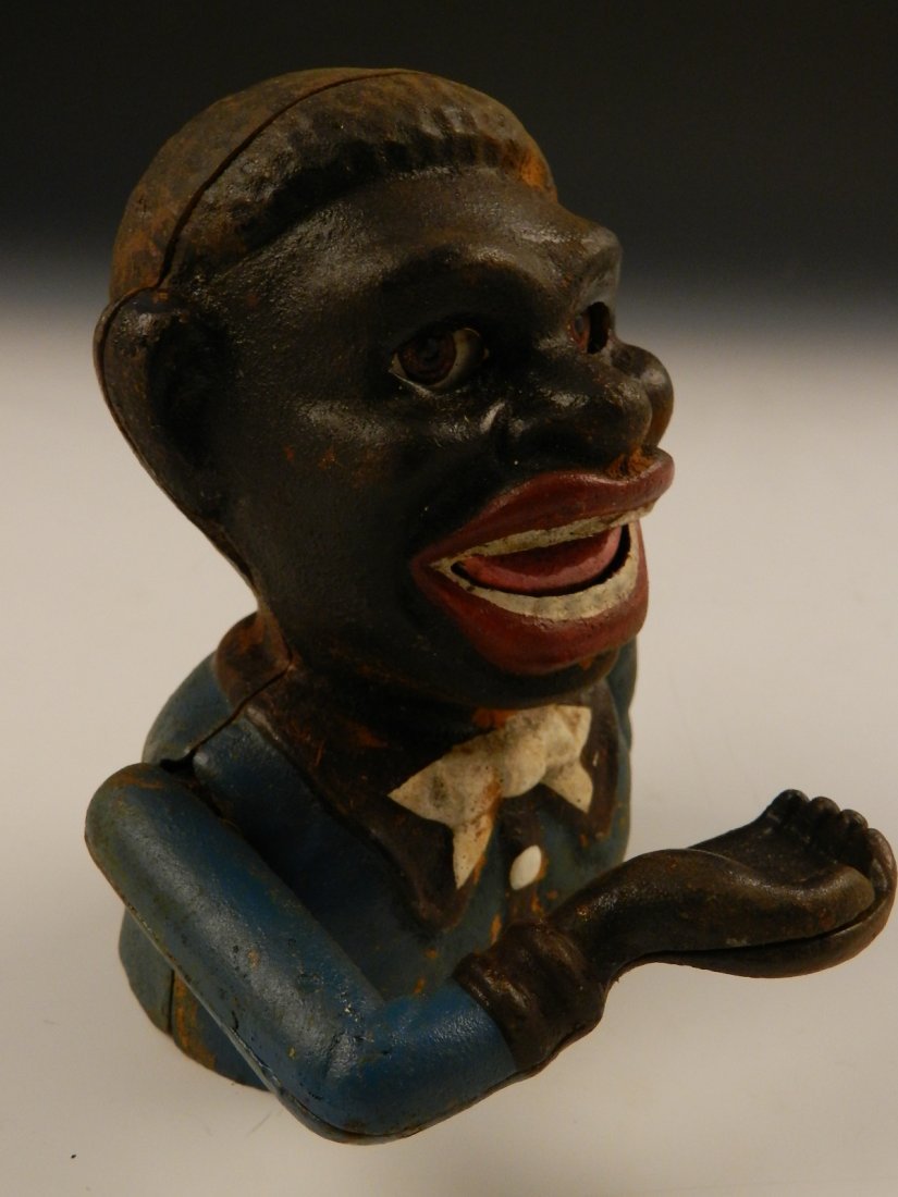 Black Americana Cast Iron Bank: Black Americana Jolly Negro cast iron bank J.E. Stevens Measures: 6 inches in height