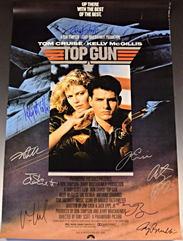 Top Gun Cast Signed Poster: Cast Signed by: Tom Cruise, Kelly McGillis, Val Kilmer, Anthony Edwards, Tom Skerritt, Tim Robbins, Meg Ryan, Tony Scott, and Jerry Bruckheimer Measures: 27 x 40 inches COA included