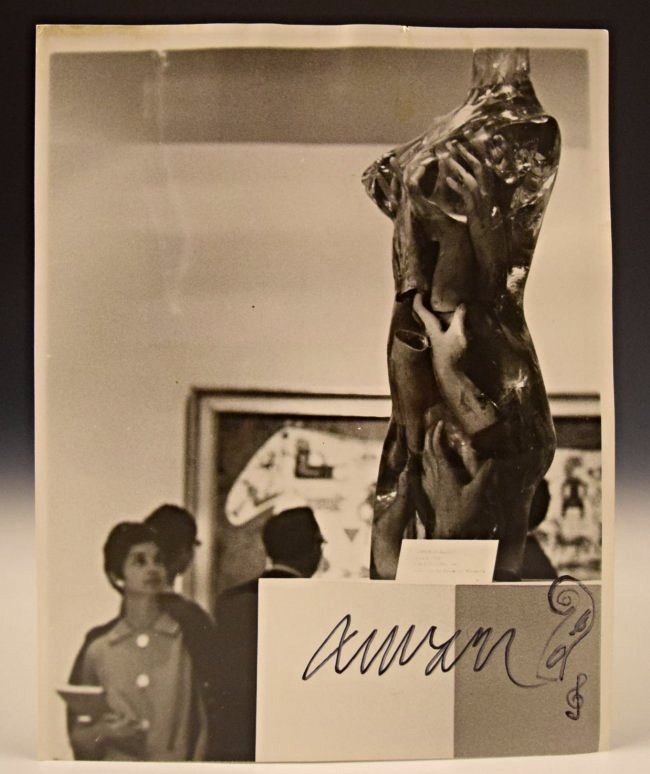 Fernandez Arman Signed Photograph: Signed black and white photograph along with an original marker sketch of an instrument done by Arman Signed on bottom Measures: 10 x 8 inches