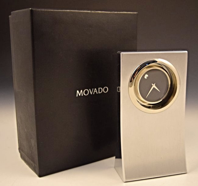 Movado Dealer Clock: Measures: 6 x 3 1/2 inches, original box included Inscribed on backside