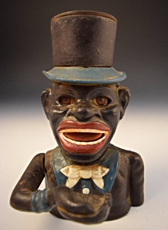 Black Americana Cast Iron Bank: Black Americana Jolly "Negro" cast iron bank J.E. Stevens Measures: 7 x 5 x 5 inches