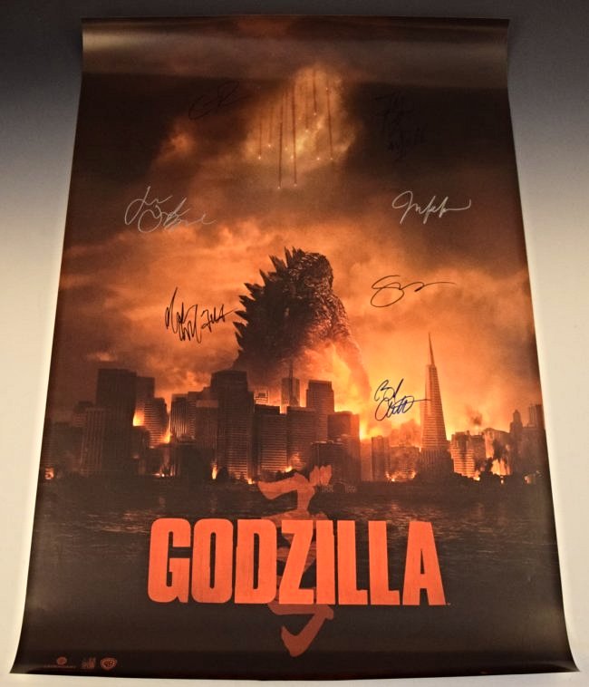 Godzilla Cast Signed Movie Poster: Signed by: Aaron Taylor-Johnson, Ken Watanabe, CJ Adams, Bryan Cranston, Elizabeth Olsen, Sally Hawkins, Juliette Binoche Measures: 36 x 24 inches Comes with COA
