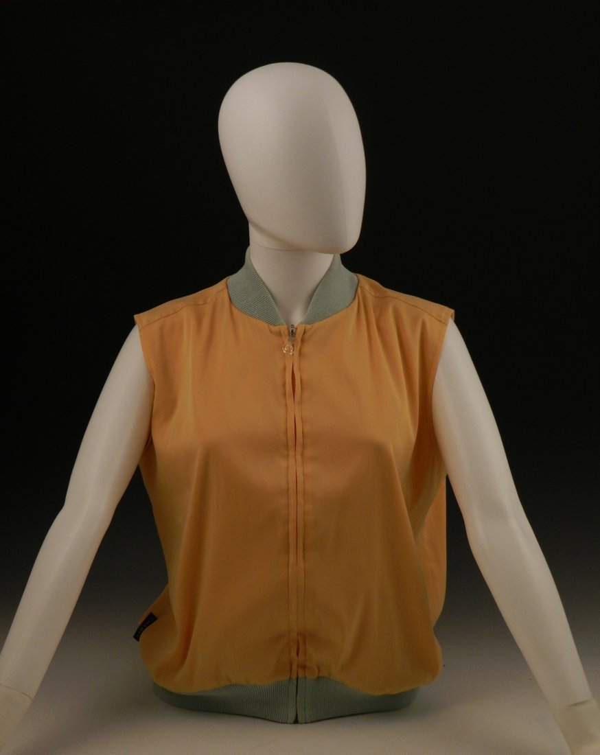Chanel Ladies Zippered Vest: A polyester Chanel zippered vest Size: 42, measures: 25 inches in length