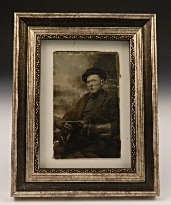 Photograph of James-Younger Gang Member: A black and white photograph of a James-Younger Gang member Provenance: This photograph comes from a large important collection of outlaw memorabilia. Many items from this collection were once given t