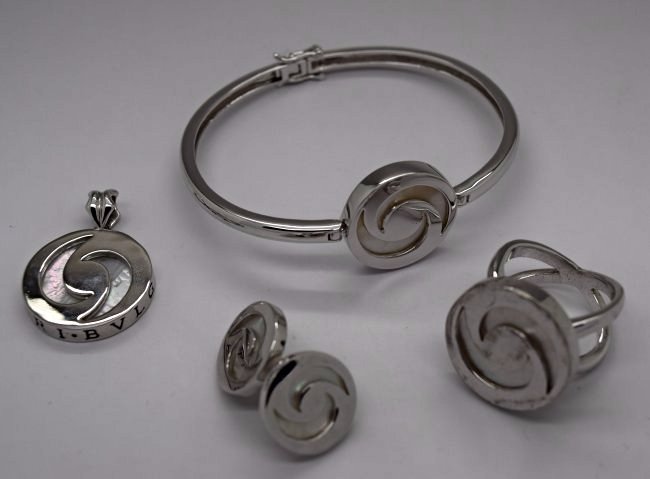 BVLGARI Set: Bvlgari ring, earrings, bracelet, and pendant set.