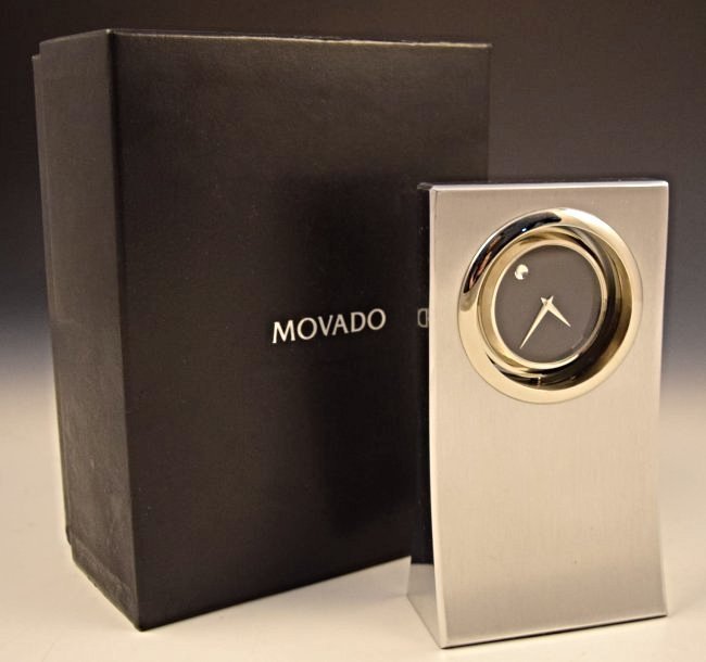 Movado Dealer Clock: Measures: 6 x 3 1/2 inches, original box included Inscribed on backside