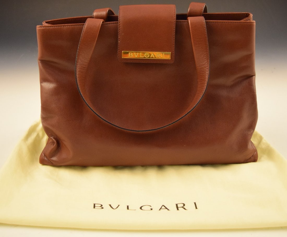 Bvlgari Handbag: Bvlgari (Bulgari) issued red leather handbag with original cloth Measures: 13 x 9 inches (bag size)