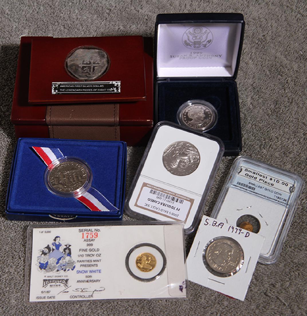 Assorted Coin Lot: Replica Piece of Eight, Two Gold Pieces, Proof Susan B Anthony(2), Proof 70 Bald Eagle 50 Cent, 50 Cent Proof Liberty Coin
