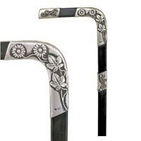 Silver Viennese Dress: Silver Viennese Dress-Late 19th Century-Applied floral and wire decorations, an ebony shaft adorned with silver and a horn ferrule, also has a matching silver collar, neck and cap-OL. 36 ¼"-$500-$1,0