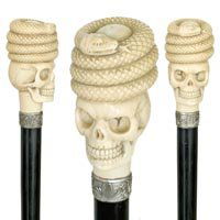 Momento Mori Ivory: Memento Mori Ivory-C. 1870-A large ivory handle, ebony shaft, chased silver collar and a horn ferrule, in outstanding condition with a superb original surface-H. 3 ½" x 2 ¼", OL. 36 ½"-$1,400-$1,80