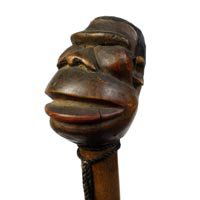 Art Deco Folk Art: Art Deco Folk Art-C. 1930-Carved two piece African American with oversized head, hardwood shaft and a brass ferrule, cane retains its original patina-H. 4² x 3 1Z2², OL. 38²-$300-$500
