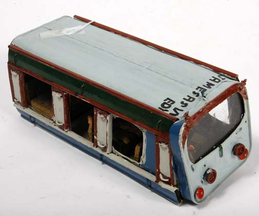 Buddy Snipes-"Bus To Tuskegee". Paint on metal. Pi: Buddy Snipes-"Bus To Tuskegee". Paint on metal. Piece is 11 x 4 x 4. Please see over 450 other lots in this sale of Outsider Art, Folk-art, folkart, contemporary art,pottery, African American Art, Nat