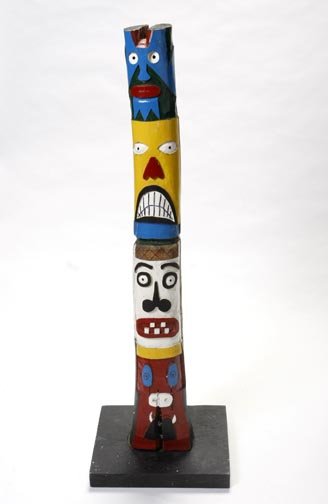 Funky folk-art totem pole, carved and painted wood: Funky folk-art totem pole, carved and painted wood and measures 37 x 5 1/2 diameter