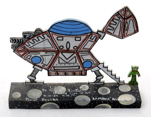 Michael Finster,, "UFO". Paint on wood cutout, sig: Michael Finster,, "UFO". Paint on wood cutout, signed and numbered 1632, 4-10-89: 11:38 pm. Measuring 9 x 7 x 2 and has had repairs