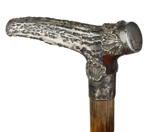 Victorian stag and silver dress cane, handle 4" x : Victorian stag and silver dress cane, handle 4" x 2 ½", signed sterling collar, stepped partridge wood shaft and a 3" metal ferrule-O.L. 37"-$200-$300