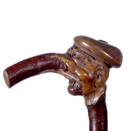 German Folk Cane-C. 1840-A massive carved cherry b: German Folk Cane-C. 1840-A massive carved cherry branch with a 6" handle of an older gentleman. Carved by skilled hands due to the out of ordinary quality of this carving. It has a nice rich patina an