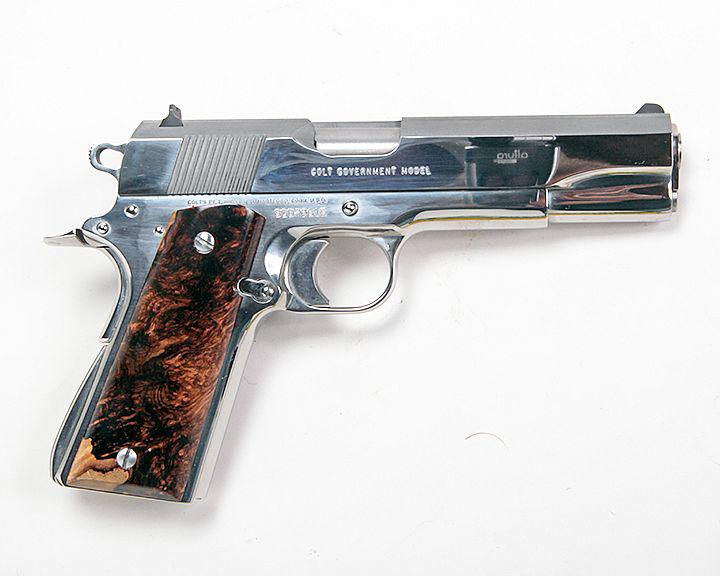 Colt 1911 38 super, 5" barrell, burl and factory grips,: Colt 1911 38 super, 5" barrell, burl and factory grips, high polished stainless steele, original paperwork and original hardcase