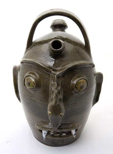 Face Jugs and outsider art lot: Randy Tobias, "Snake Man" Fired and glazed pottery face jug , Signed and measures 13 x 8 and Walter Flemming; "face jug " Fired and glazed p pottery and measures 3 1/2 tall and Two Tom Hitchcock figur
