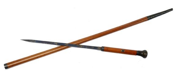 Horn Sword Cane: Horn Sword Cane-Circa 1770-A two tier Malacca shaft, 12 ½" blued and etched blade, horn handle with mother of pearl inlaid, silver eyelets and collars, and a 4 ½" brass ferrule-H. 1 ½" x 1 ½", O.L