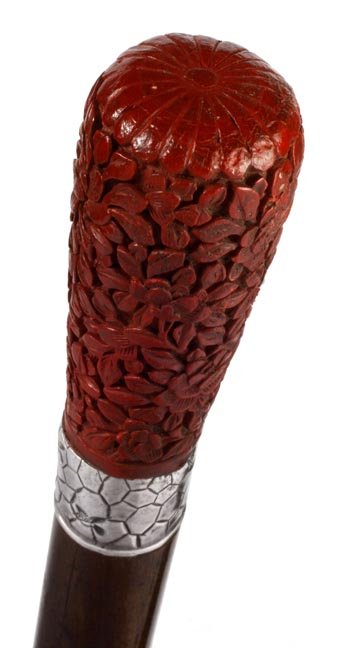 Japanses Cinnabar Lacquered Handle Cane: Japanese Cinnabar Lacquered Handle-Circa 1890-A very ornately carved handle, spider web signed sterling collar with flying birds, exotic wood shaft and a brass ferrule-H. 3" x 1 ¼", O.L. 34 ½"-$500-