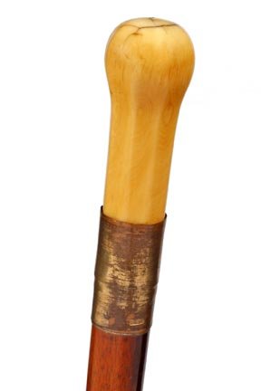 Nautical Sword Cane- C. 1875- A whale ivory hexago: Nautical Sword Cane- C. 1875- A whale ivory hexagonal handle, 11 ¾" blade with blood grooves, large brass collar, cherry shaft and a 3 ½" brass and iron ferrule.O.L. 36" $500-$700