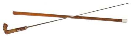 Horn Sword Cane-Circa 1890-A horse hoof horn handle: Horn Sword Cane-Circa 1890-A horse hoof horn handle with an inlaid silver medallion, push button gold filled collar, 28" four-sided etched blade, split malacca shaft and a stopper ferrule. There is so