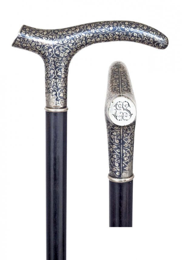 Tula Russian Dress Cane-Circa 1880-An elegant silv: Tula Russian Dress Cane-Circa 1880-An elegant silver handle, ebony shaft, unreadable hallmarks and a horn ferrule-H. 4 ½" x 2 ½", O.L. 37"-$500-$1,000