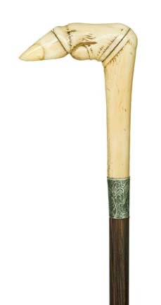 Walrus Ivory Dress-Circa 1860-A carved walrus ivor: Walrus Ivory Dress-Circa 1860-A carved walrus ivory hoof foot, engraved silver collar, rosewood shaft and a horn ferrule-H. 4 ¼" x 3 ¼", O.L. 36 ¾"-$500-$700