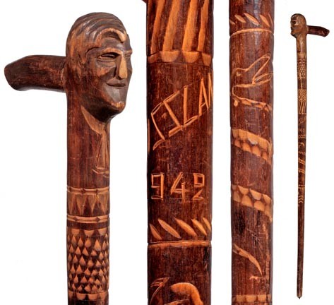 Russian Folk Art Cane-Dated 1942-A WWII Russian fo: Russian Folk Art Cane-Dated 1942-A WWII Russian folk art cane which has various carvings, a gentleman's head and a pike ferrule-O.L. 37"-$200-$400